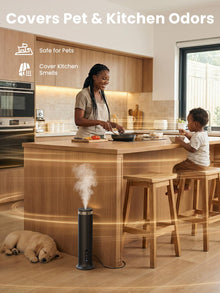 XEITIN pet-safe black tower cold-air scent diffuser eliminating kitchen cooking smells and pet odors in open modern kitchen with family and sleeping puppy